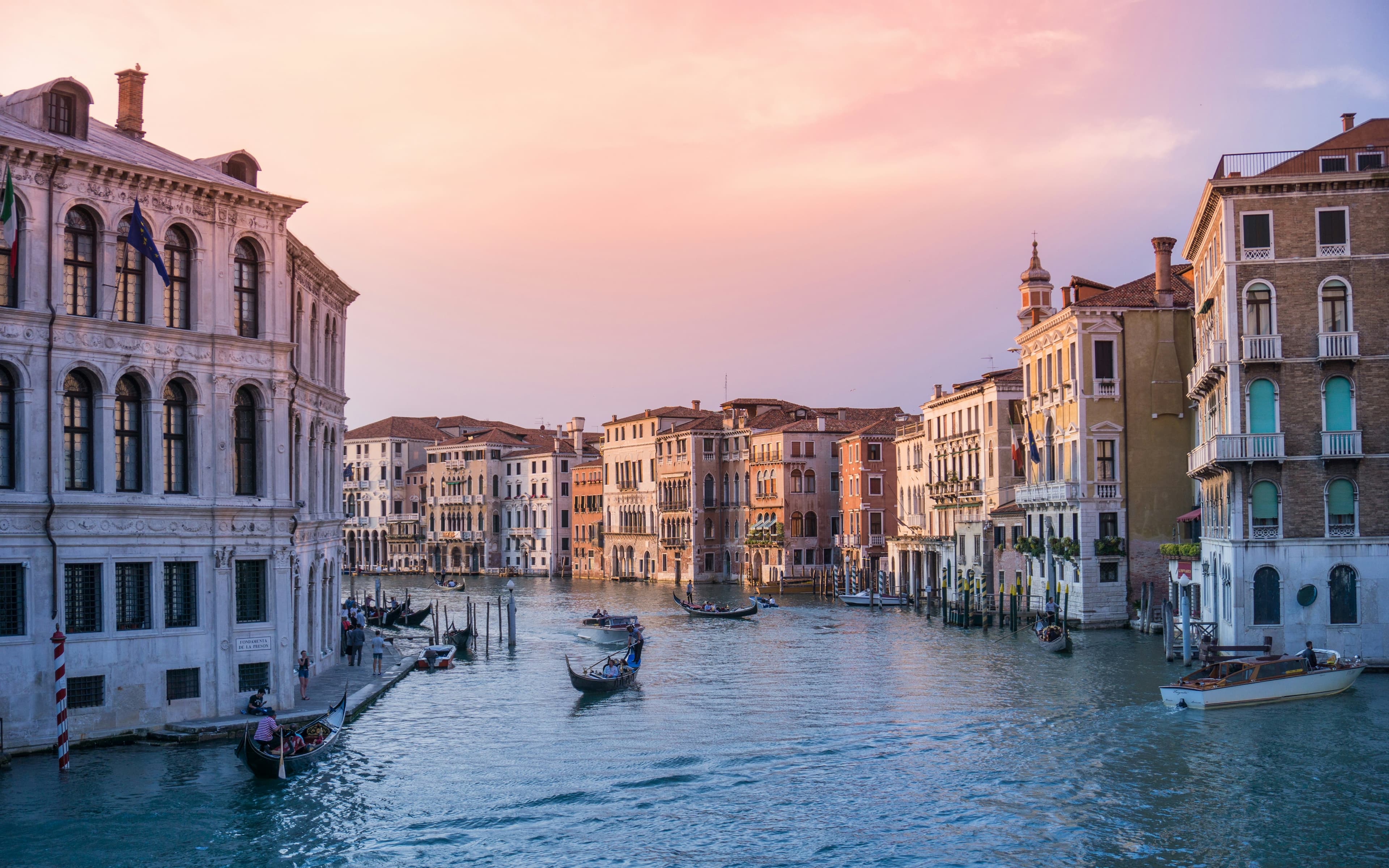 Aerial view of Venice canals and historic buildings at sunset